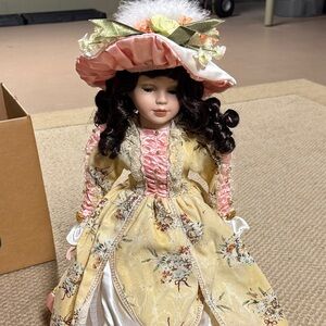 Elegant Victorian Doll with Pink and Yellow Dress